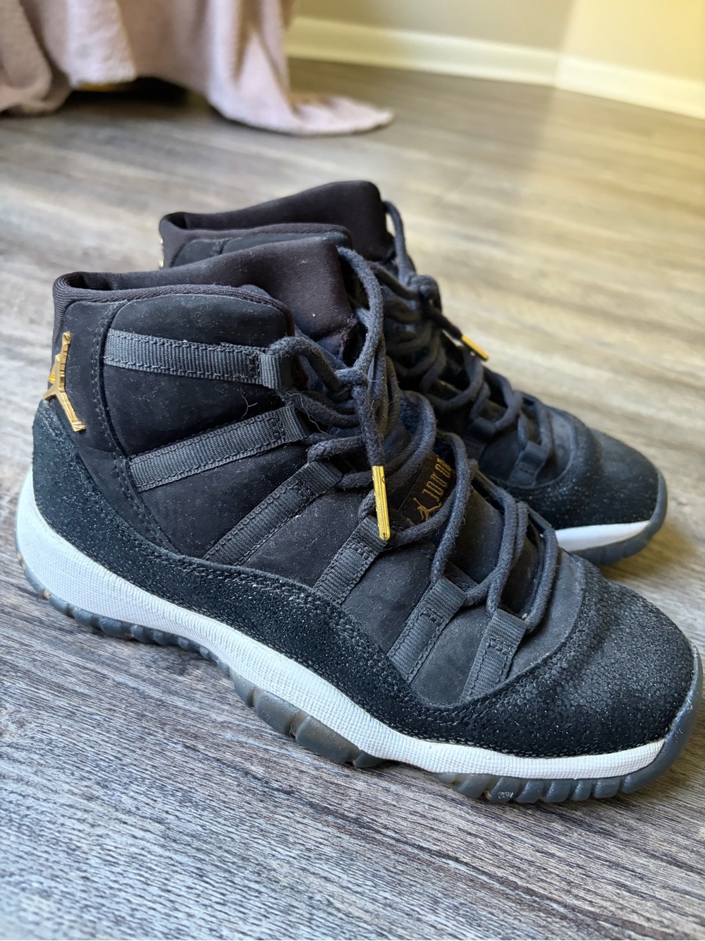 Jordan High-Top Sneakers in Black with Gold Accents